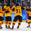 GANGNEUNG, SOUTH KOREA - FEBRUARY 25: Germany's Felix Schutz #55 celebrates with Brooks Macek #12, Moritz Muller #91 and Patrick Hager #50 after scoring a second period goal on Team Olympic Athletes from Russia during gold medal round action at the PyeongChang 2018 Olympic Winter Games. (Photo by Matt Zambonin/HHOF-IIHF Images)

